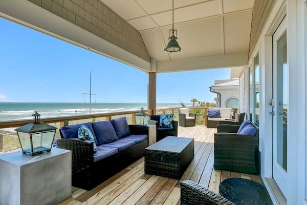 Oceanfront porch at an NC beach rental for large groups.